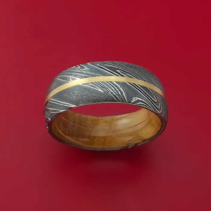 Kuro Damascus Steel Ring with 14k Yellow Gold Inlay and Interior Hardwood Sleeve Custom Made Band Lashbrook Rings Kuro Damascus Steel Ring with 14k Yellow Gold Inlay and Interior Hardwood Sleeve Custom Made Band Lashbrook Rings