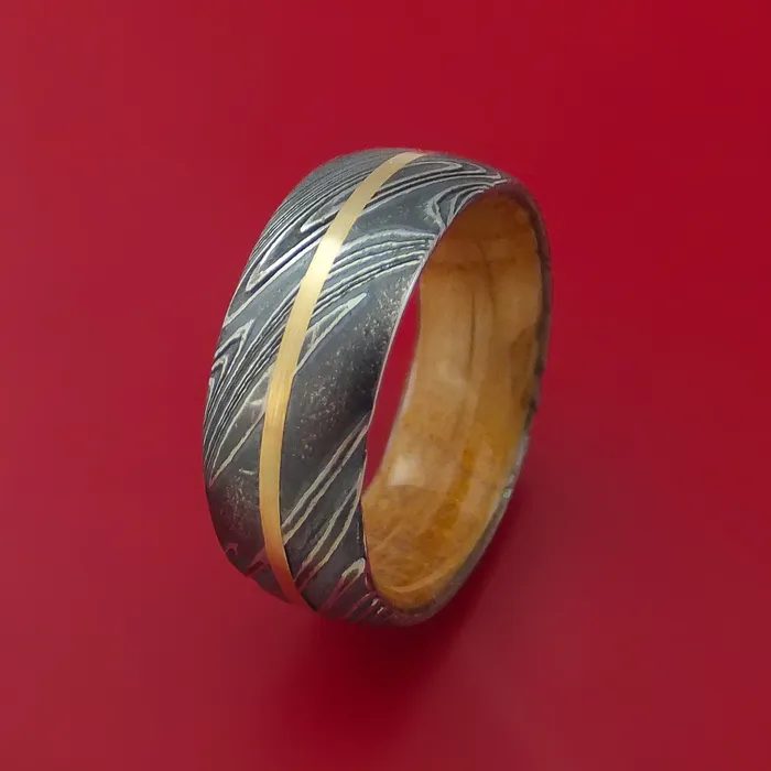 Kuro Damascus Steel Ring with 14k Yellow Gold Inlay and Interior Hardwood Sleeve Custom Made Band Lashbrook Rings Kuro Damascus Steel Ring with 14k Yellow Gold Inlay and Interior Hardwood Sleeve Custom Made Band Lashbrook Rings
