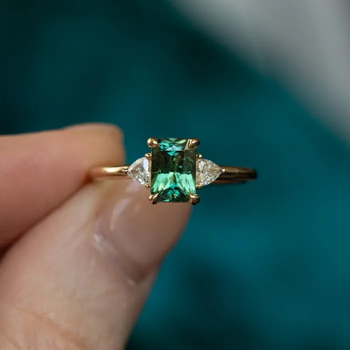 116ct Teal Green Radiant Cut Montana Sapphire and Trillion Diamond Low Profile Three Stone ring in 14k Yellow Gold Anueva Jewelry Rings