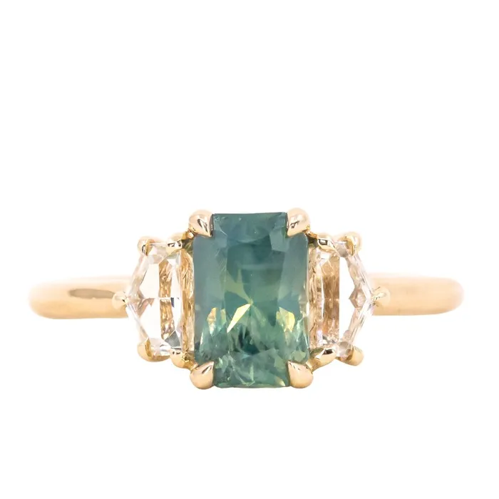 24 HOUR HOLD 147ct Radiant Opalescent Teal Sapphire and White Sapphire Three Stone Ring in 14k Yellow Gold Anueva Jewelry Rings 24 HOUR HOLD 147ct Radiant Opalescent Teal Sapphire and White Sapphire Three Stone Ring in 14k Yellow Gold Anueva Jewelry Rings