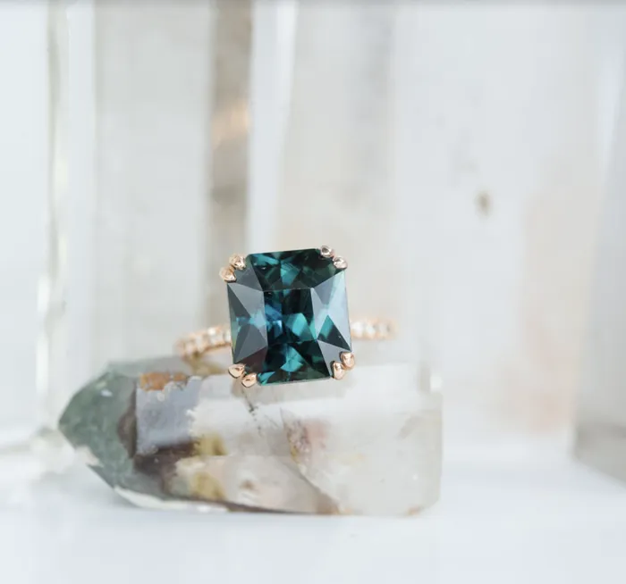 Anueva Jewelry Rings 567ct Radiant Cut Teal Sapphire Ring with French Set Diamond Studded Band in 18k Rose Gold