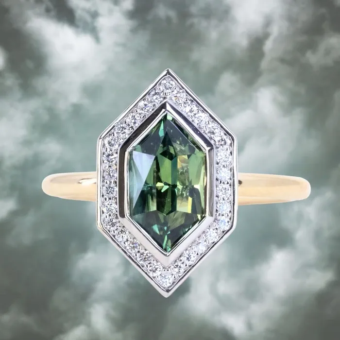 Rings 217ct Elongated Madagascar Teal Green Sapphire Bezel Set Diamond Halo Ring in Twotone Platinum and Yellow Gold Anueva Jewelry Rings 217ct Elongated Madagascar Teal Green Sapphire Bezel Set Diamond Halo Ring in Twotone Platinum and Yellow Gold Anueva Jewelry